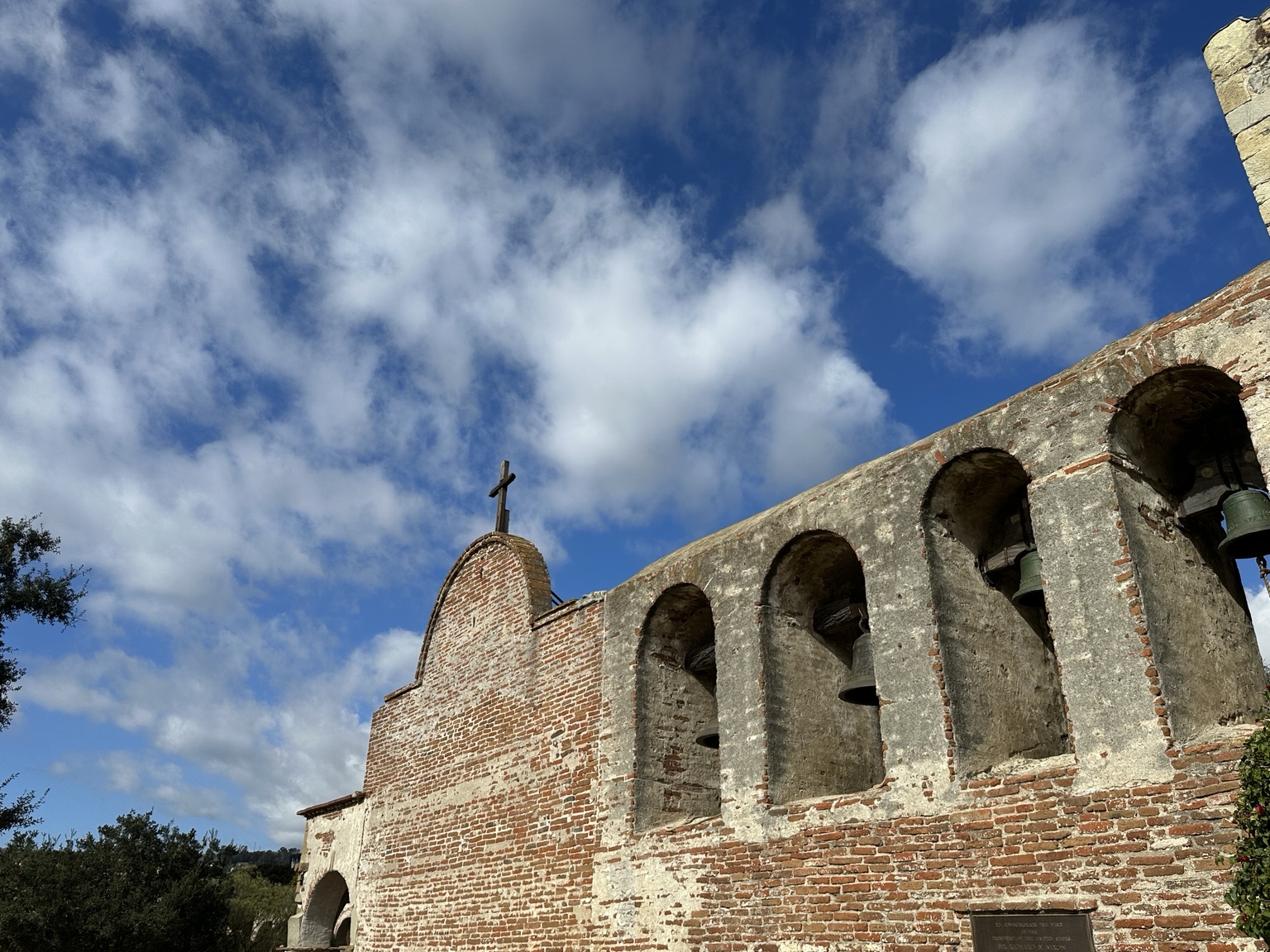 Historic Mission San Juan Capistrano bells beneath a blue California sky